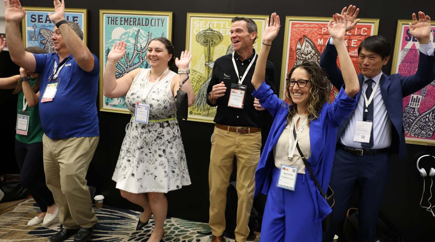 Attendees cheering together during an Opening Joynote